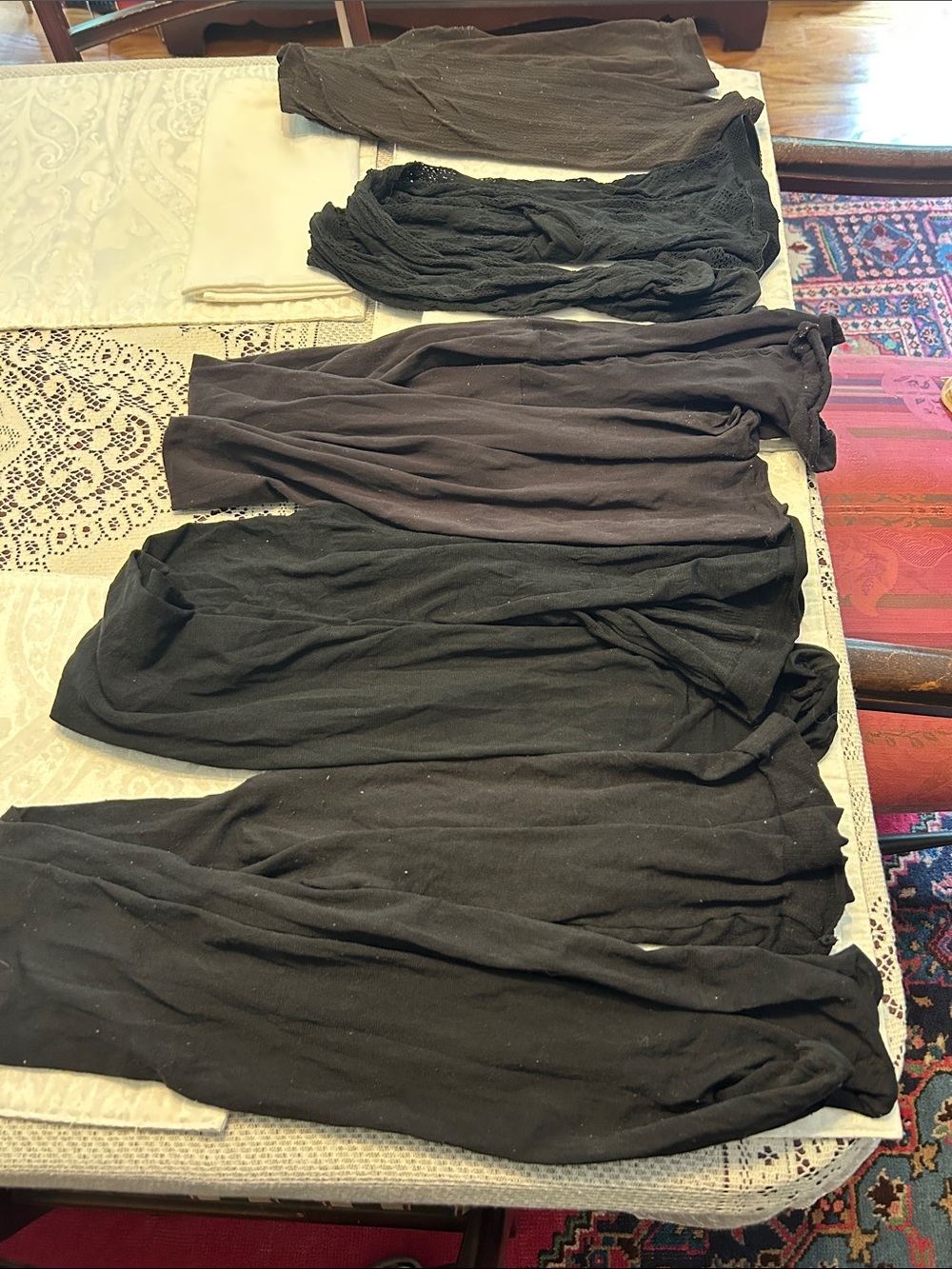 5 pairs of women’s tights. Four Black (one lace pattern) and one brown. Used.